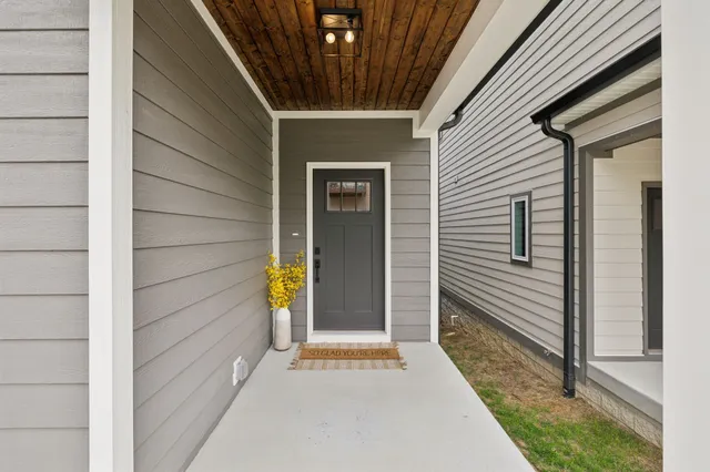 a side view of a house with a door