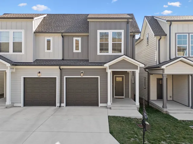 a front view of a house with yard