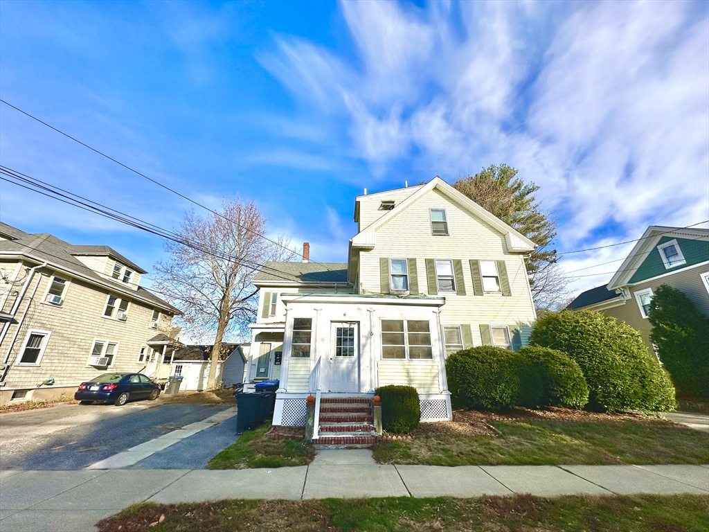 6 Grant Street, Unit 2 Natick, MA 01760 - Photo 1 of 15 a front view of a house with a yard