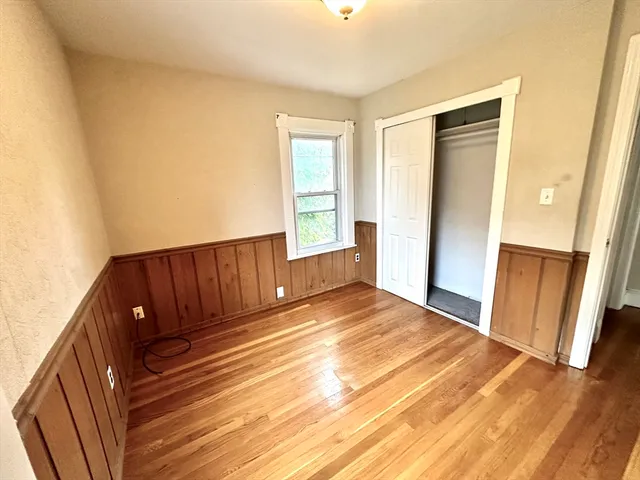 a view of a room with wooden floor and stairs