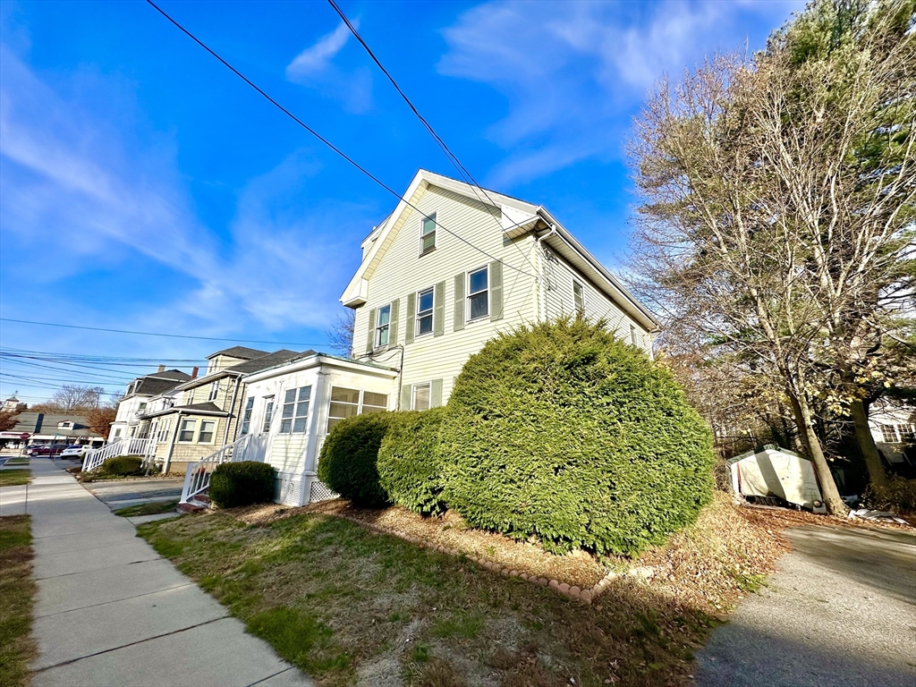 6 Grant Street, Unit 2 Natick, MA 01760 - Photo 2 of 15 a view of multiple houses with a yard