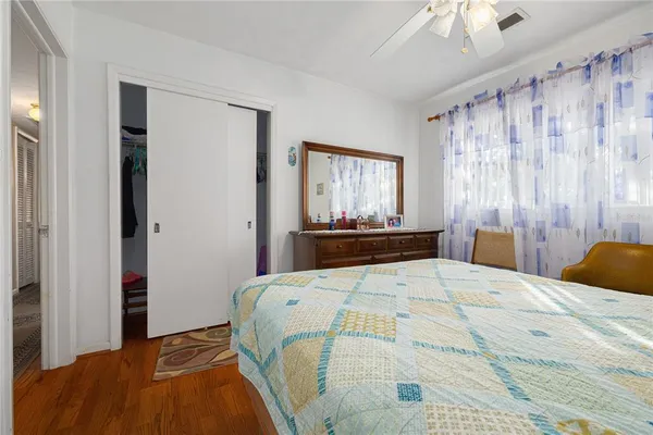 a bedroom with a bed and a dresser