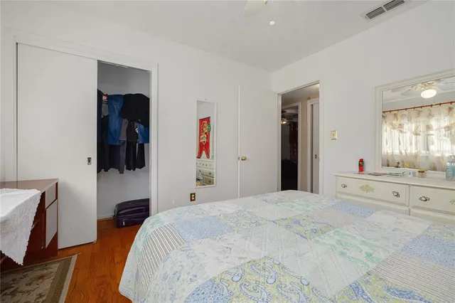 a bedroom with a bed and a television in it