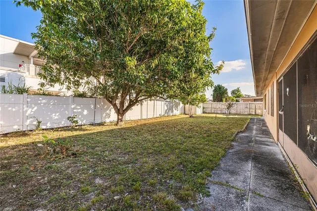 a view of a yard with an trees