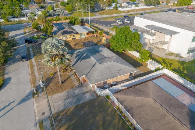 a view of a backyard with swimming pool