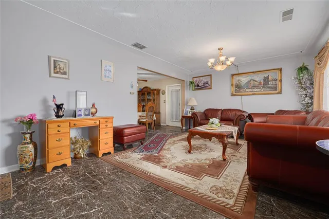a living room with furniture and a table