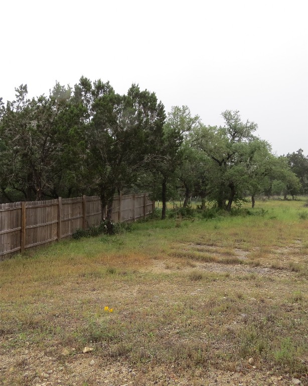 0 Pecos Drive Wimberley, TX 78676 - Photo 5 of 12 a backyard of a house with trees