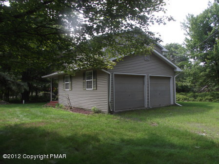 31-7 Crestview Road Blakeslee, PA 18610 - Photo 12 of 14 a view of a backyard with a large tree