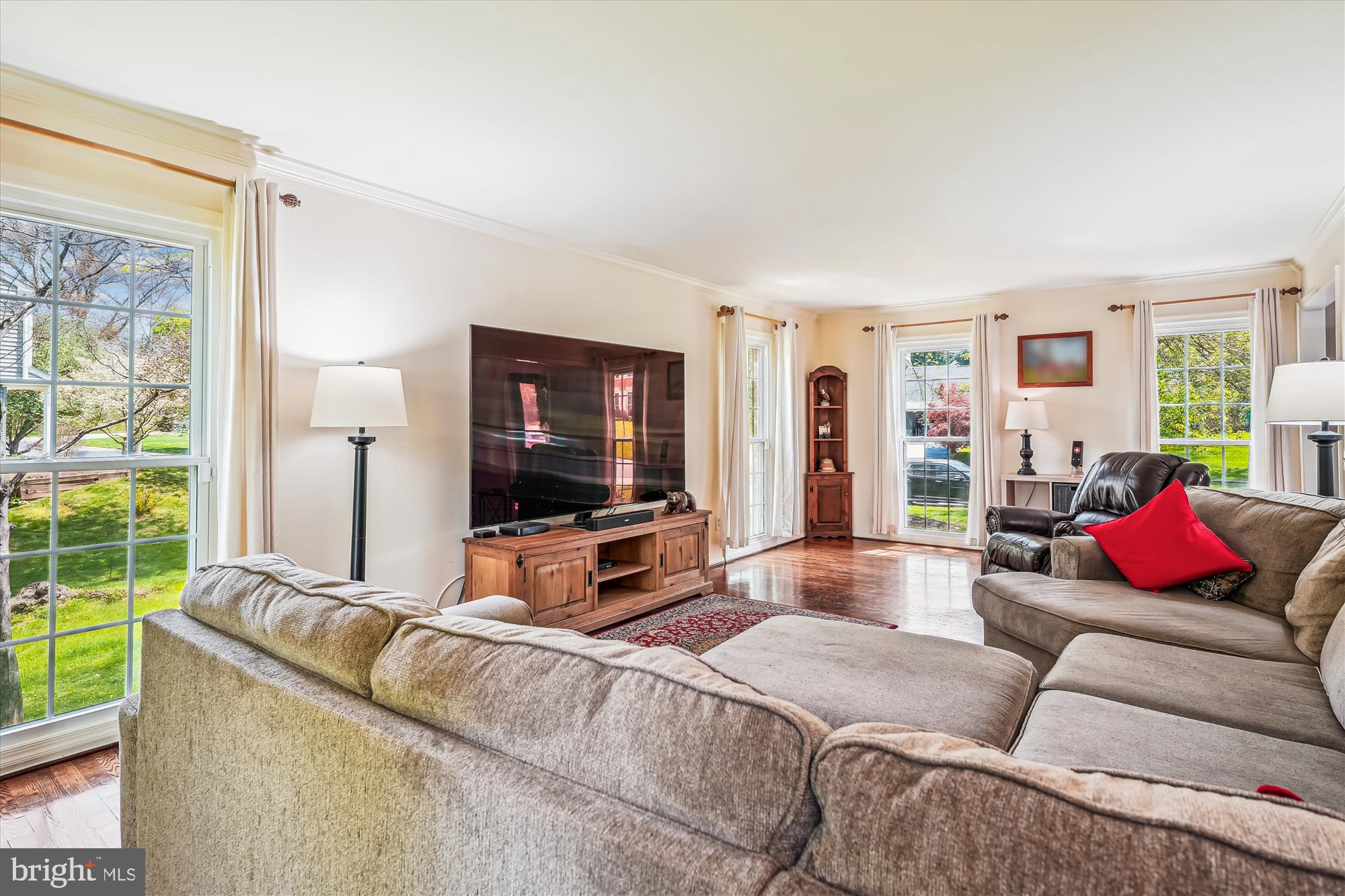 9117 Paddock Lane Potomac, MD 20854 - Photo 12 of 69 a living room with furniture and a flat screen tv