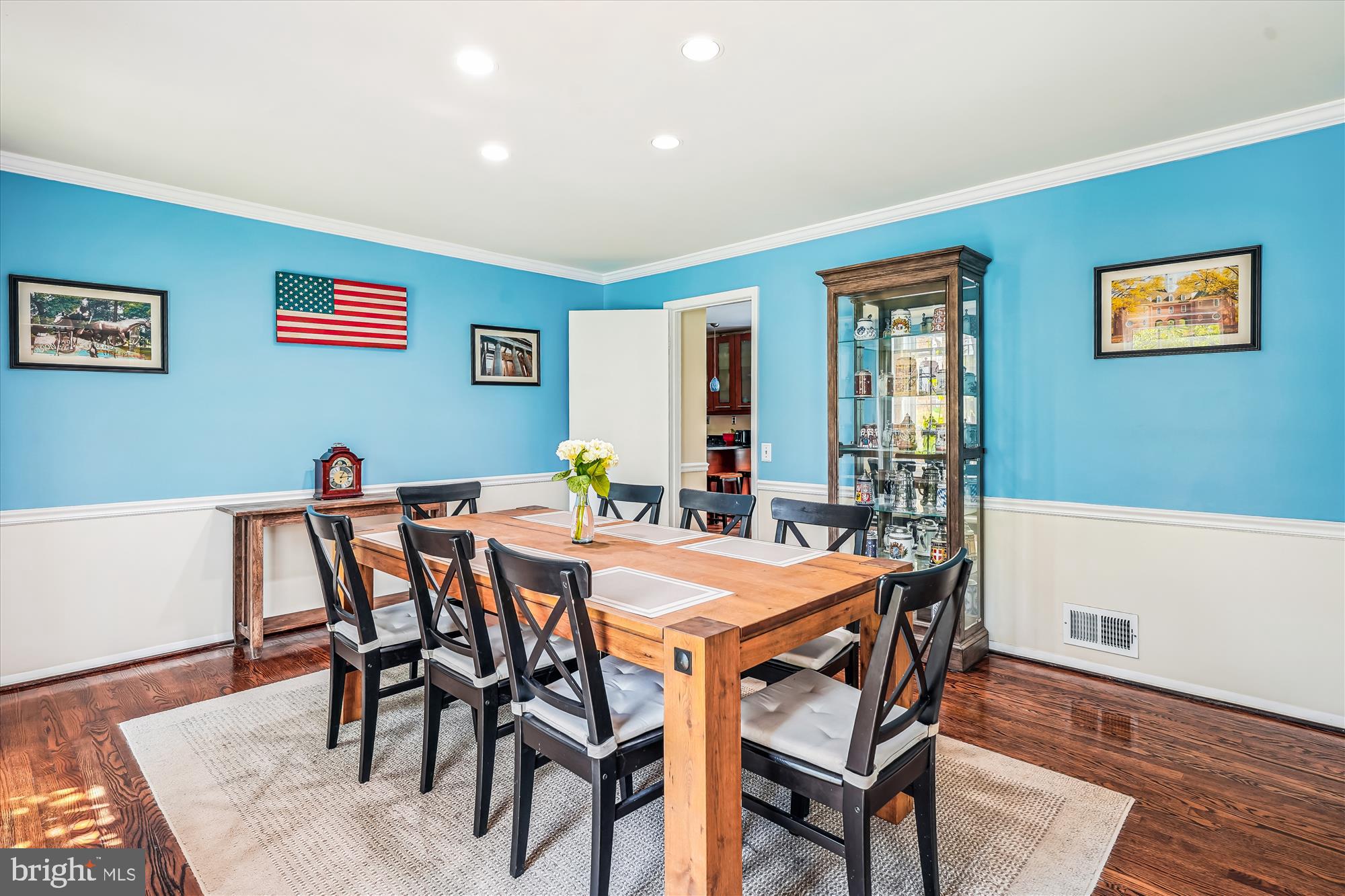 9117 Paddock Lane Potomac, MD 20854 - Photo 16 of 69 a view of a dining room with furniture and wooden floor