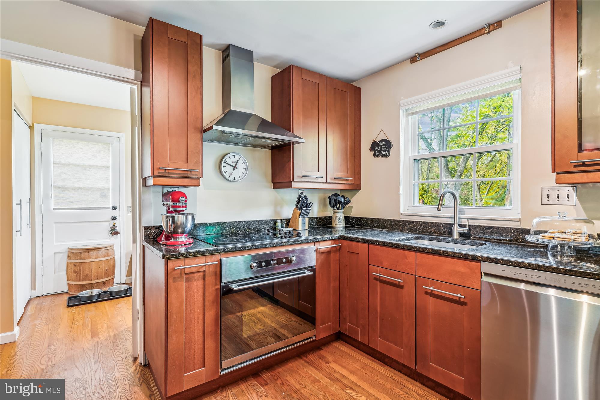 9117 Paddock Lane Potomac, MD 20854 - Photo 20 of 69 a kitchen with stainless steel appliances granite countertop a stove and a sink