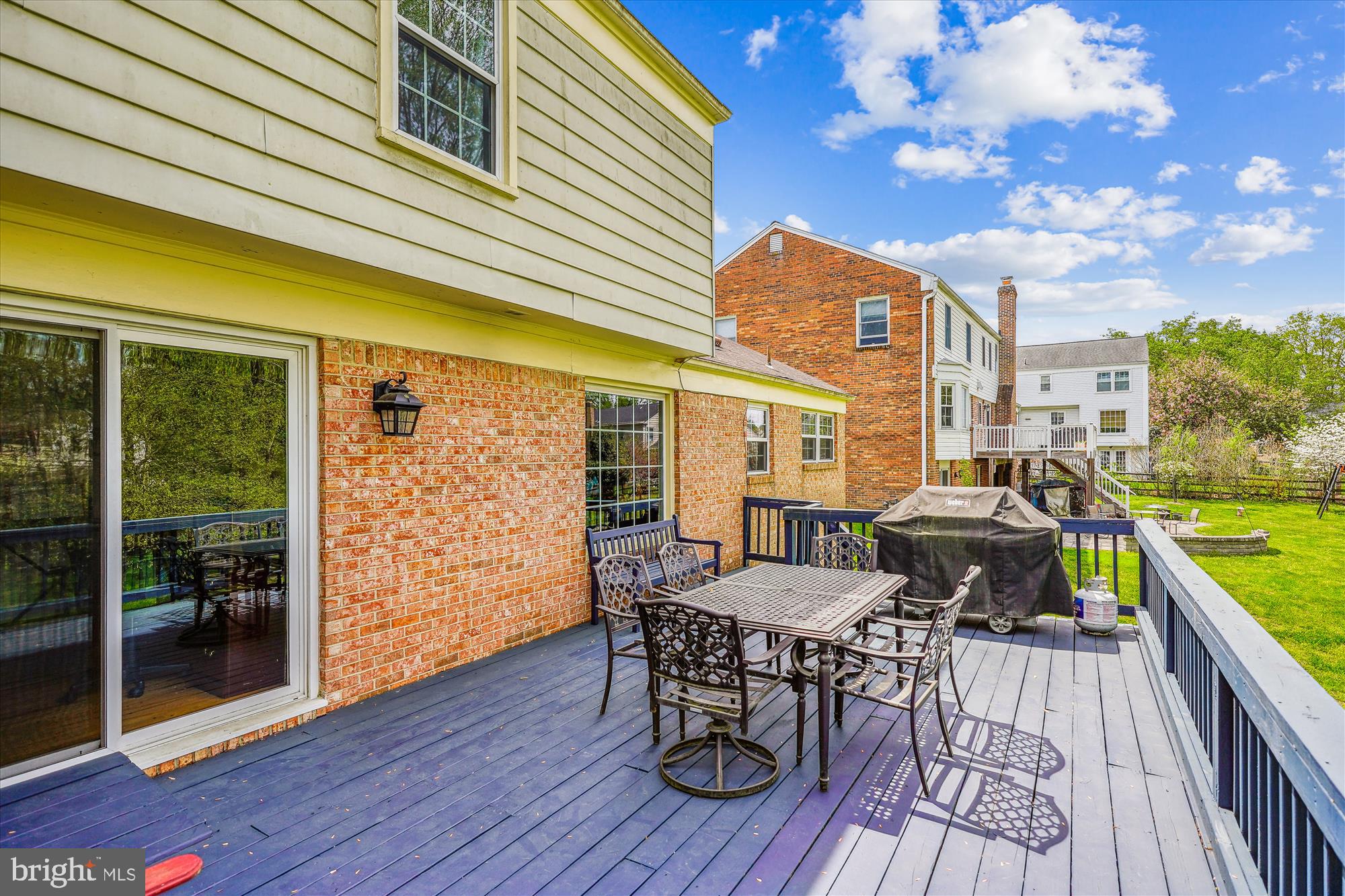 9117 Paddock Lane Potomac, MD 20854 - Photo 29 of 69 a view of a patio with table and chairs and wooden floor