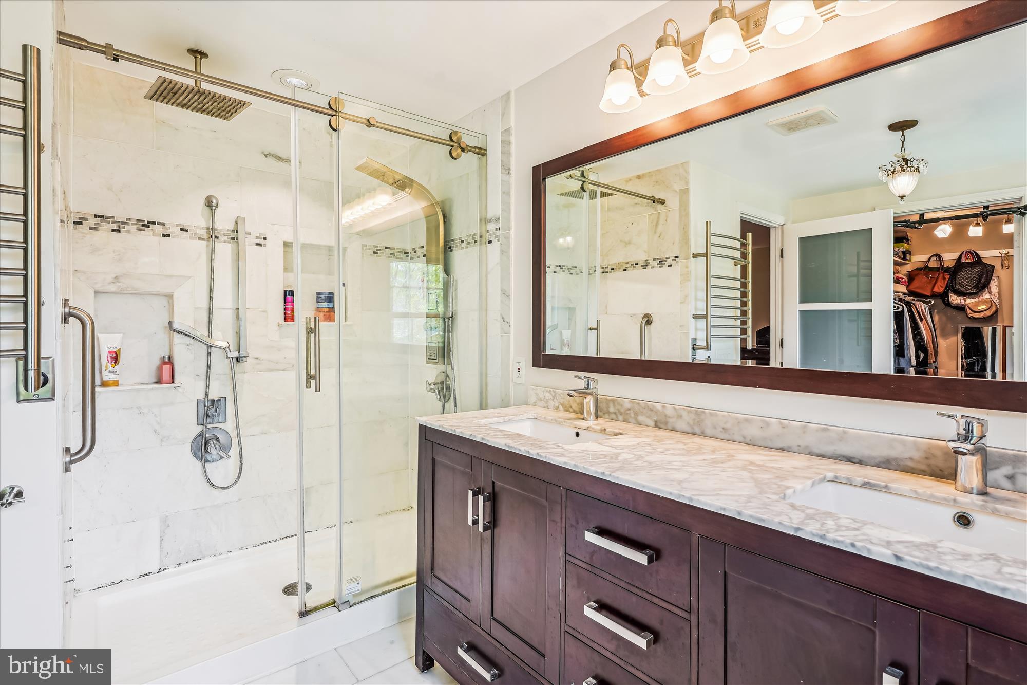 9117 Paddock Lane Potomac, MD 20854 - Photo 36 of 69 a bathroom with a granite countertop sink mirror and double