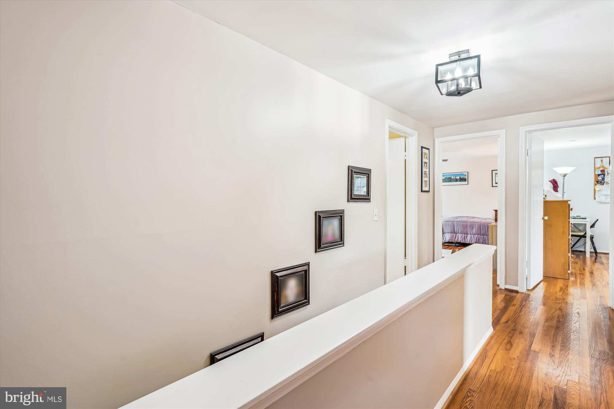 9117 Paddock Lane Potomac, MD 20854 - Photo 40 of 69 a view of a hallway with wooden floor