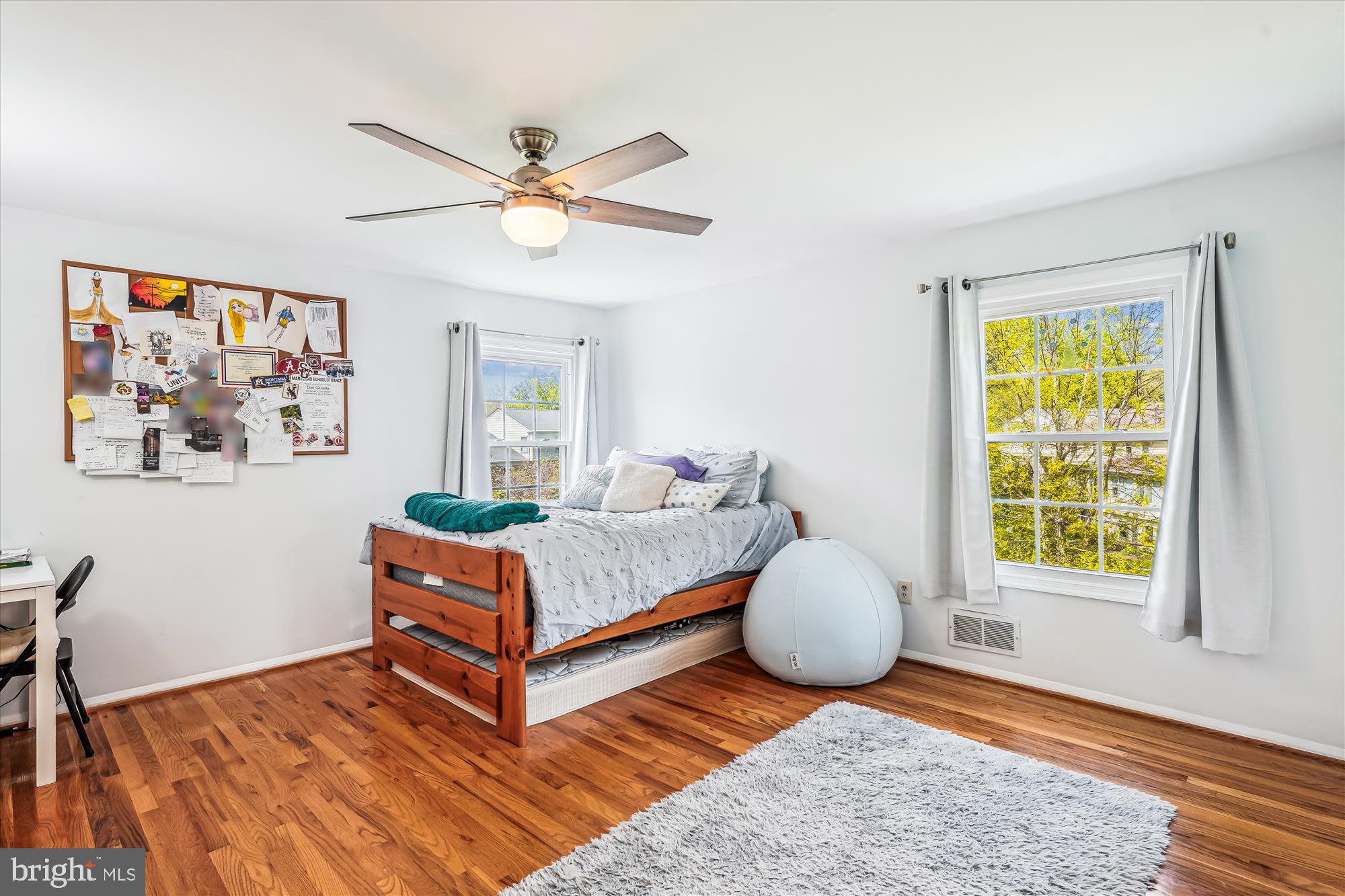 9117 Paddock Lane Potomac, MD 20854 - Photo 41 of 69 a living room with a bed and a window
