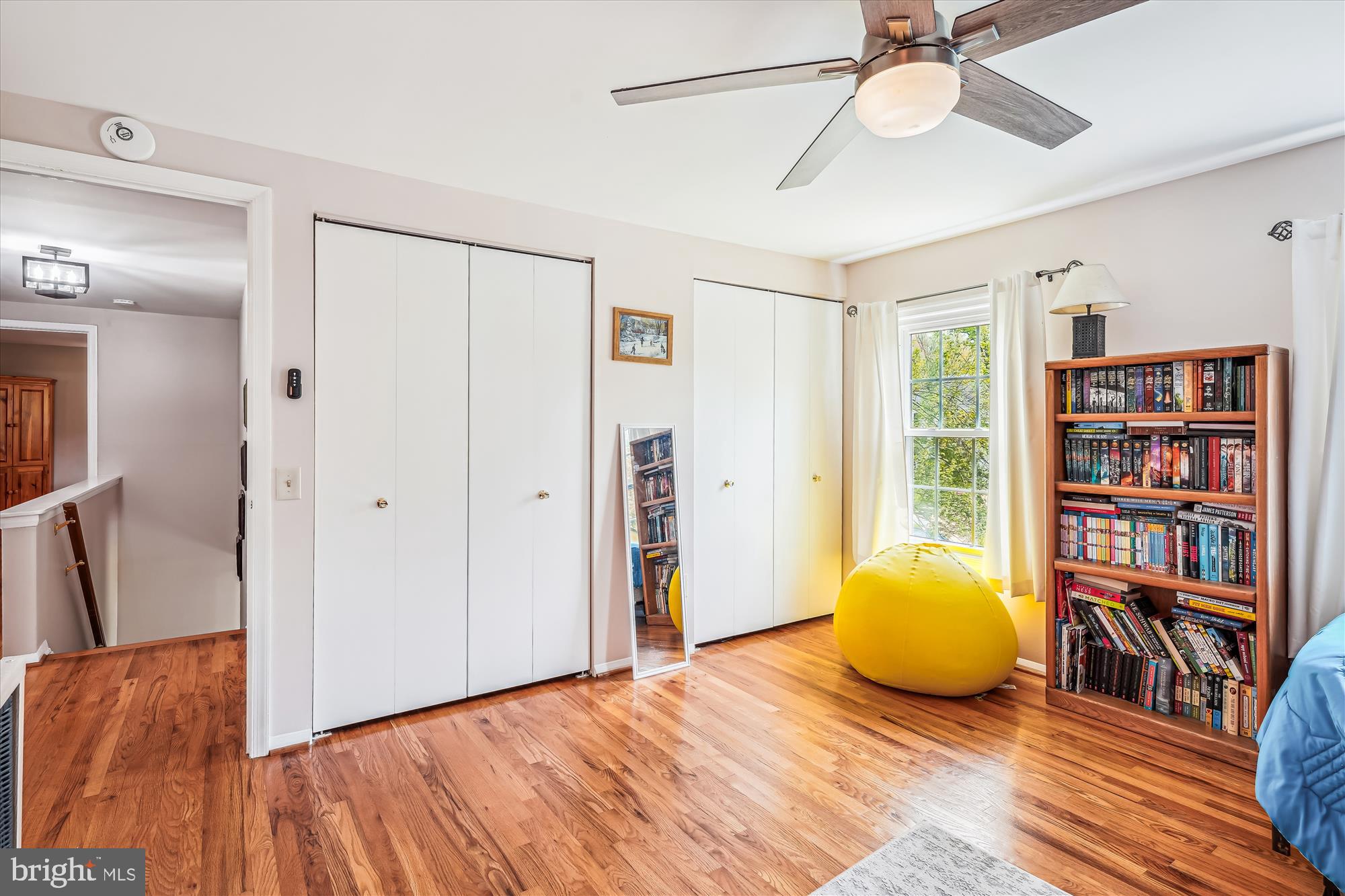 9117 Paddock Lane Potomac, MD 20854 - Photo 44 of 69 a view of an empty room with a window and wooden floor