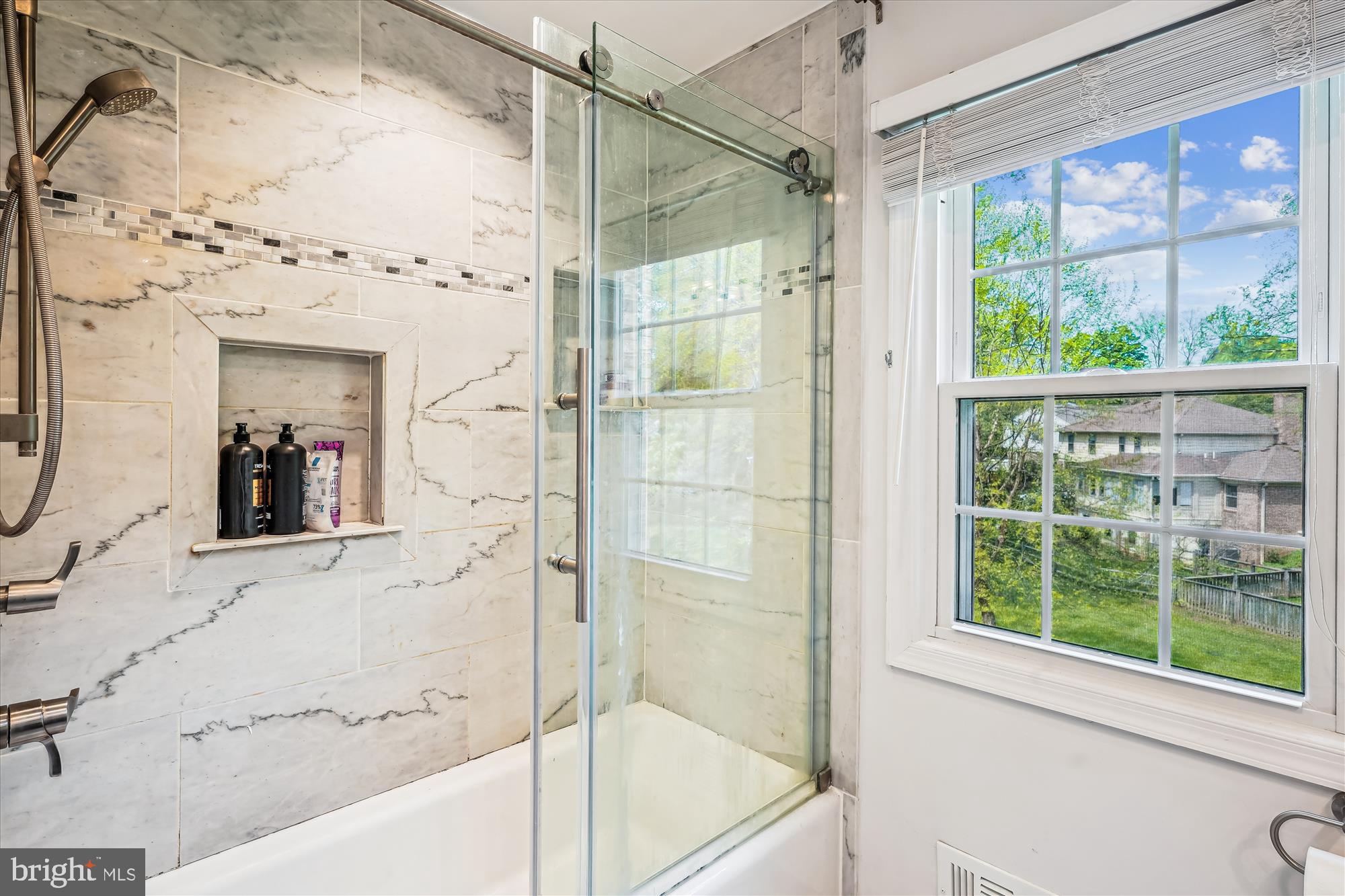 9117 Paddock Lane Potomac, MD 20854 - Photo 46 of 69 a bathroom with a bathtub and a shower