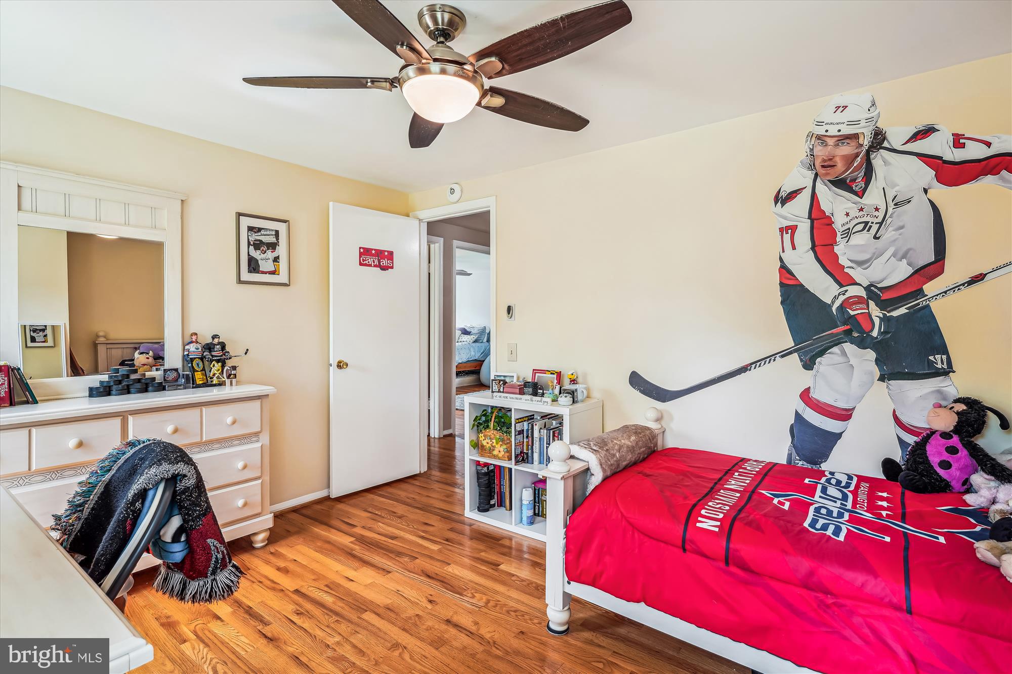 9117 Paddock Lane Potomac, MD 20854 - Photo 48 of 69 a bedroom with a bed and a chandelier