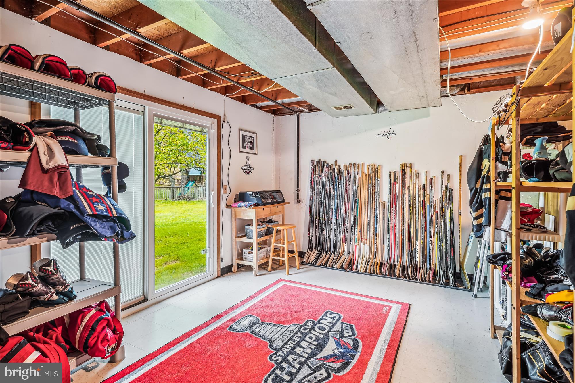 9117 Paddock Lane Potomac, MD 20854 - Photo 53 of 69 a view of walk in closet with clothes and shoes