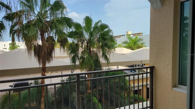 a view of balcony with a potted plant