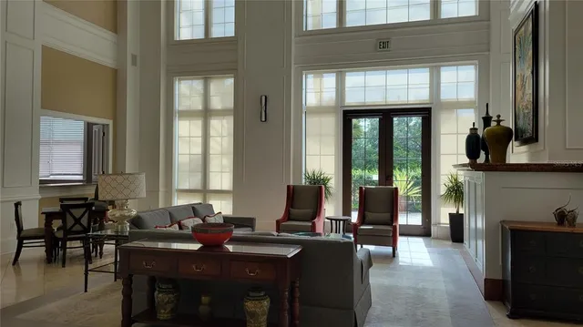 a view of dining room and livingroom with furniture window and wooden floor