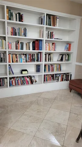 a living room with bookshelf