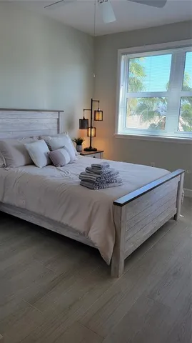 a bedroom with a bed and window