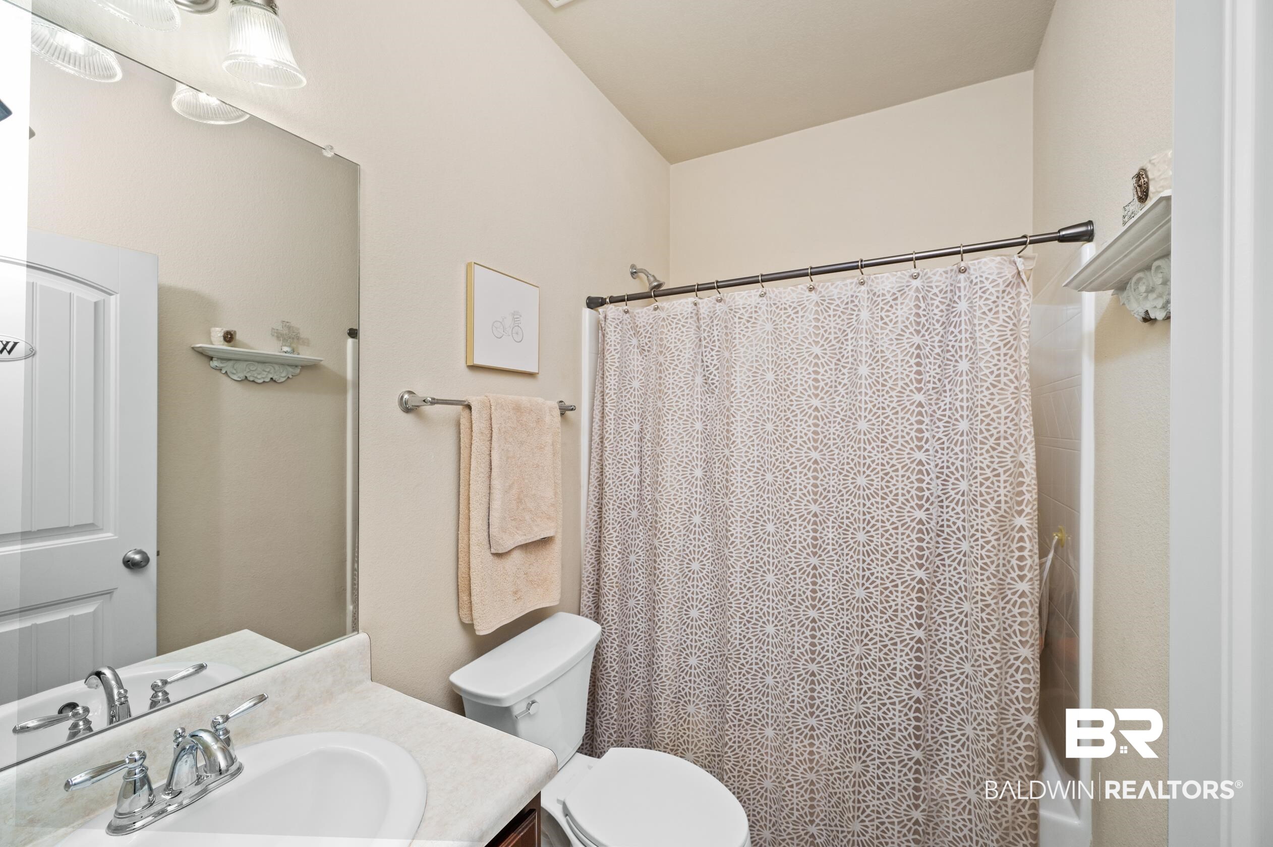 745 Bonaventure Street Fairhope, AL 36532 - Photo 20 of 36 Full bathroom featuring vanity, toilet, and shower / tub combo