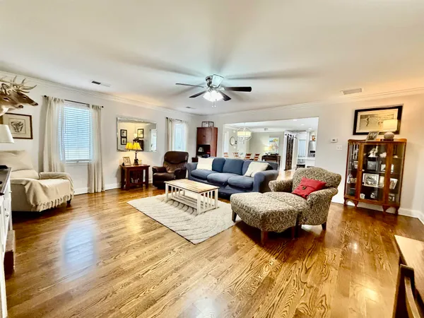 a living room with furniture and a lamp