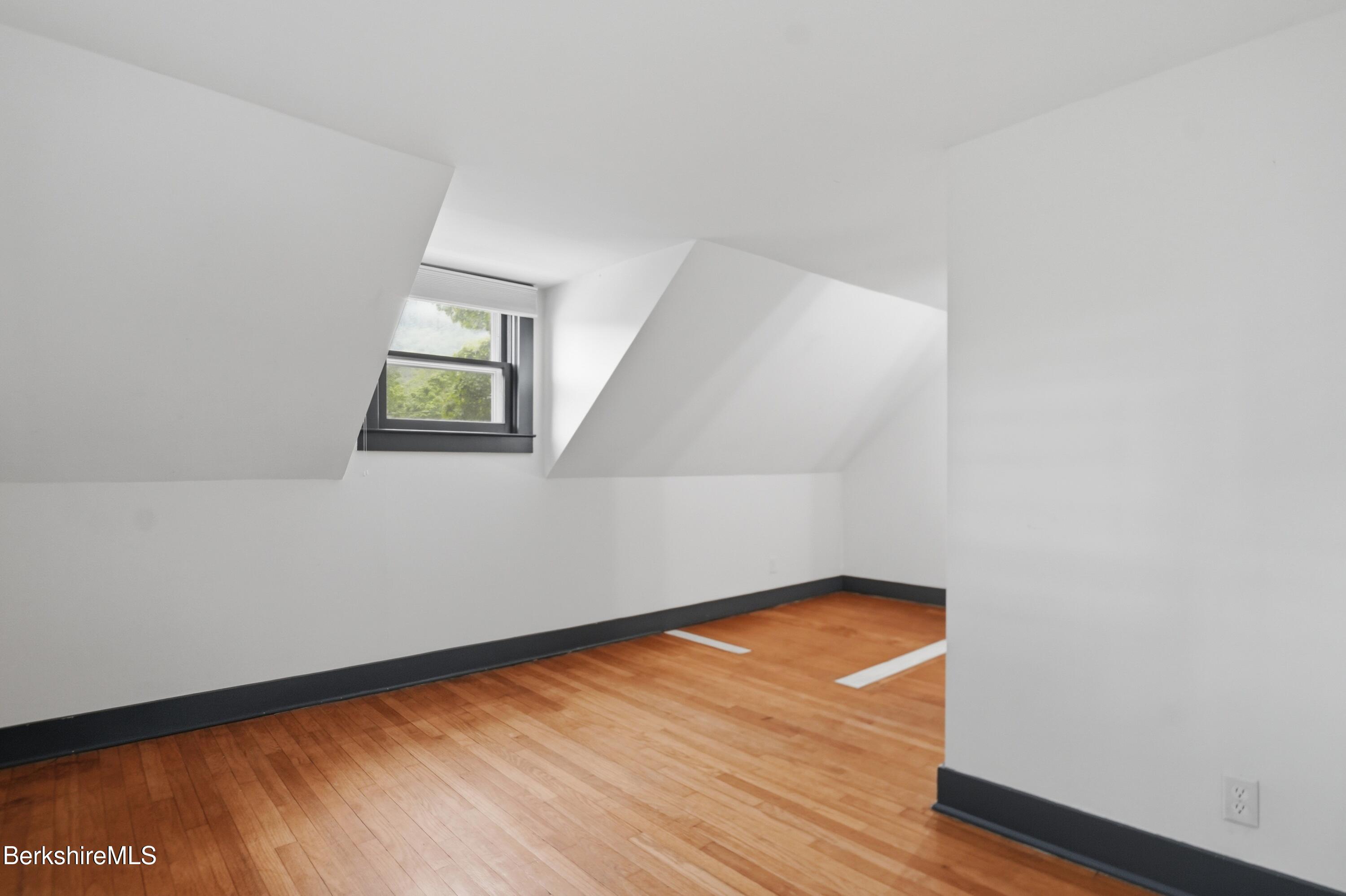 4 Stockbridge Road West Stockbridge, MA 01266 - Photo 57 of 94 an empty room with wooden floor and windows