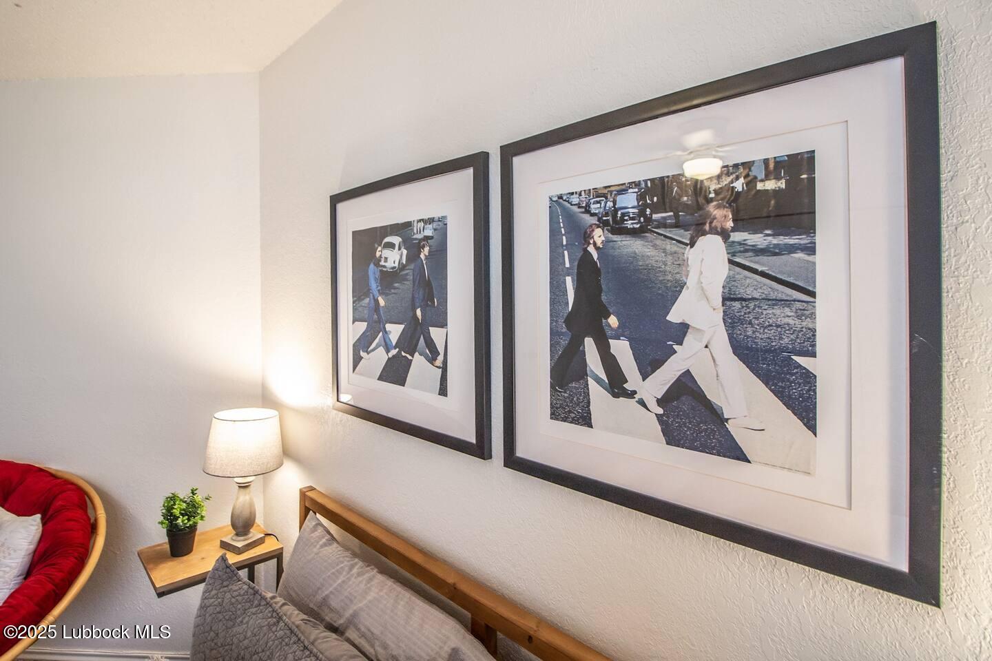 5808 6th Street, Unit B Lubbock, TX 79416 - Photo 12 of 23 a picture of a room that has a painting on the wall and a large mirror