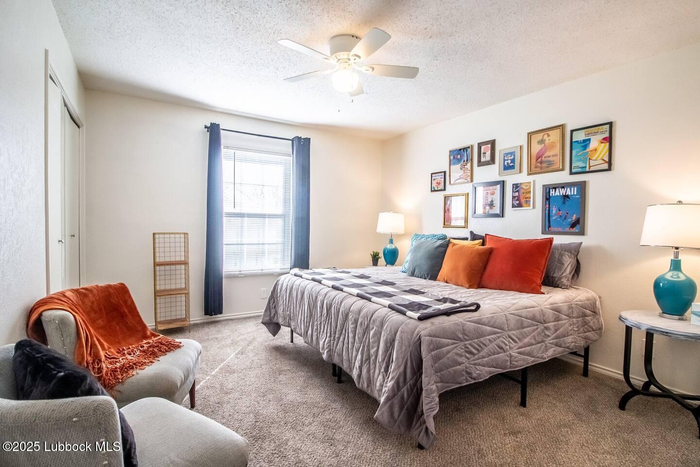 5808 6th Street, Unit B Lubbock, TX 79416 - Photo 14 of 23 a bedroom with bed couch and window