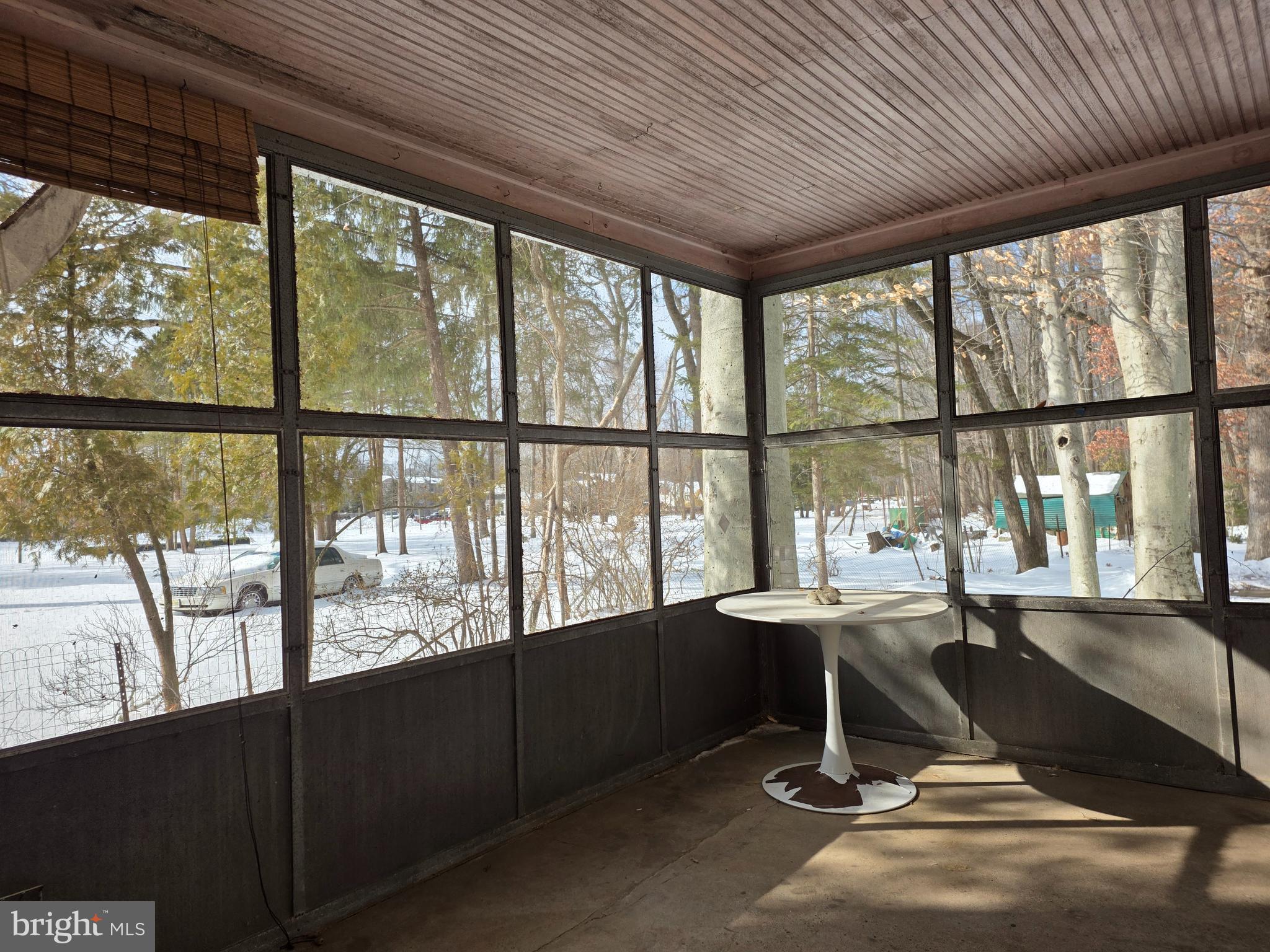 370 Eggert Crossing Road Lawrenceville, NJ 08648 - Photo 11 of 11 a living room with a large window and table