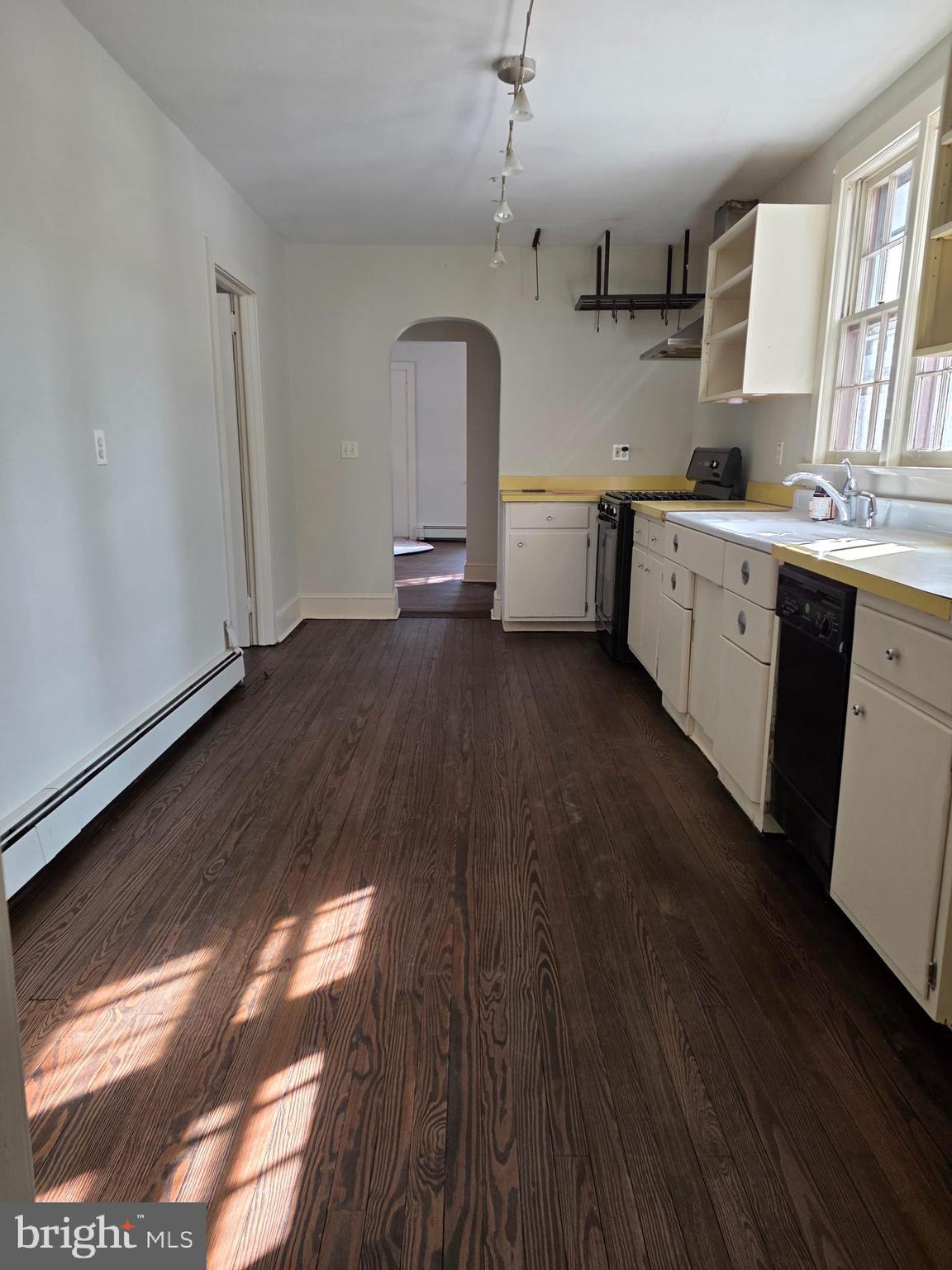 370 Eggert Crossing Road Lawrenceville, NJ 08648 - Photo 4 of 11 a view of a kitchen with a sink and wooden floor