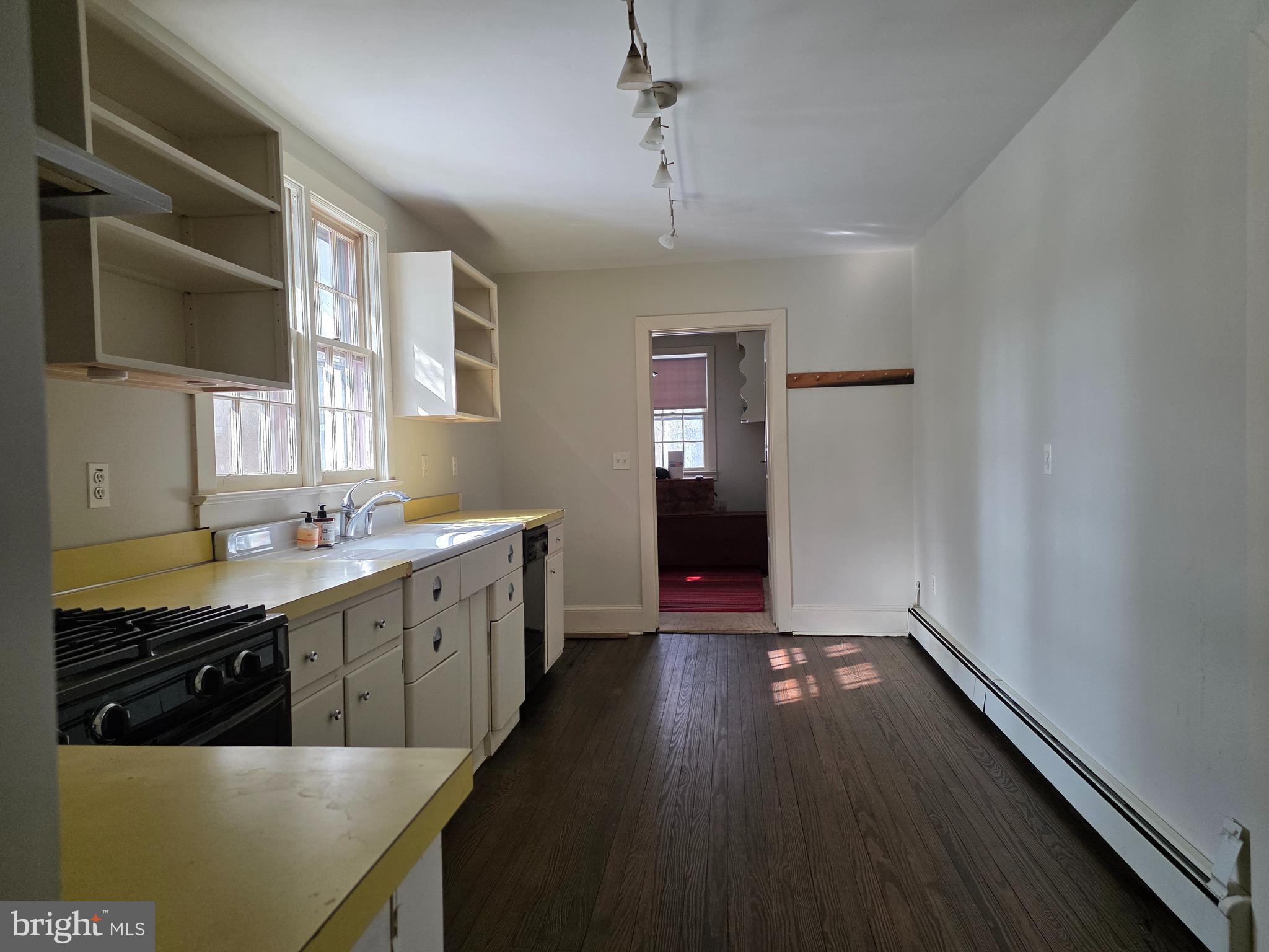 370 Eggert Crossing Road Lawrenceville, NJ 08648 - Photo 5 of 11 a kitchen with wooden cabinets a sink and dishwasher