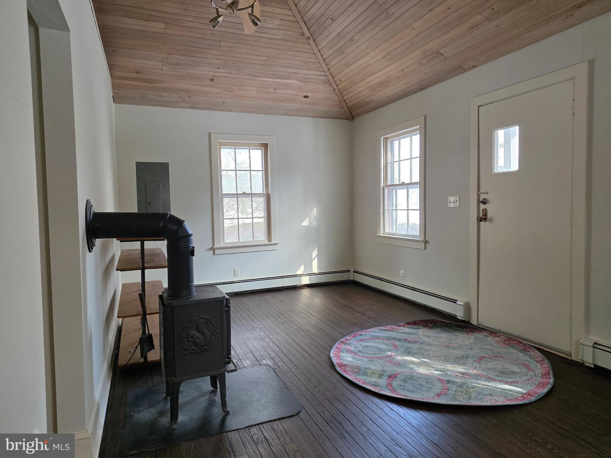 370 Eggert Crossing Road Lawrenceville, NJ 08648 - Photo 8 of 11 an empty room with wooden floor and windows