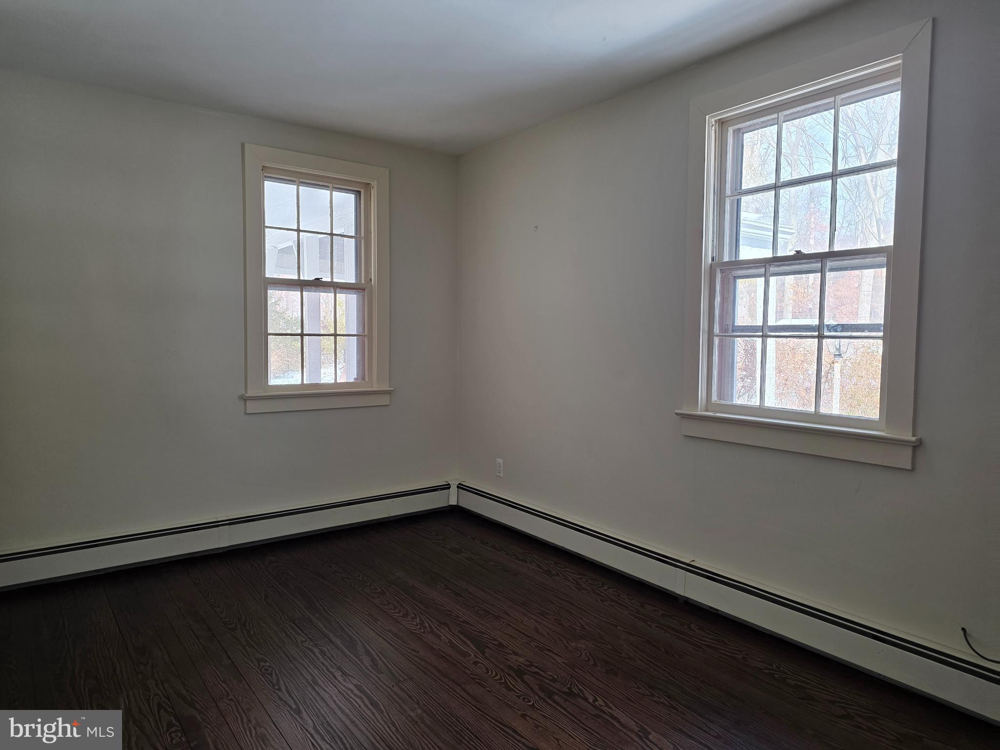 370 Eggert Crossing Road Lawrenceville, NJ 08648 - Photo 10 of 11 an empty room with wooden floor and windows