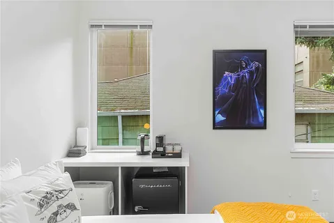 a kitchen with a sink cabinets and a window