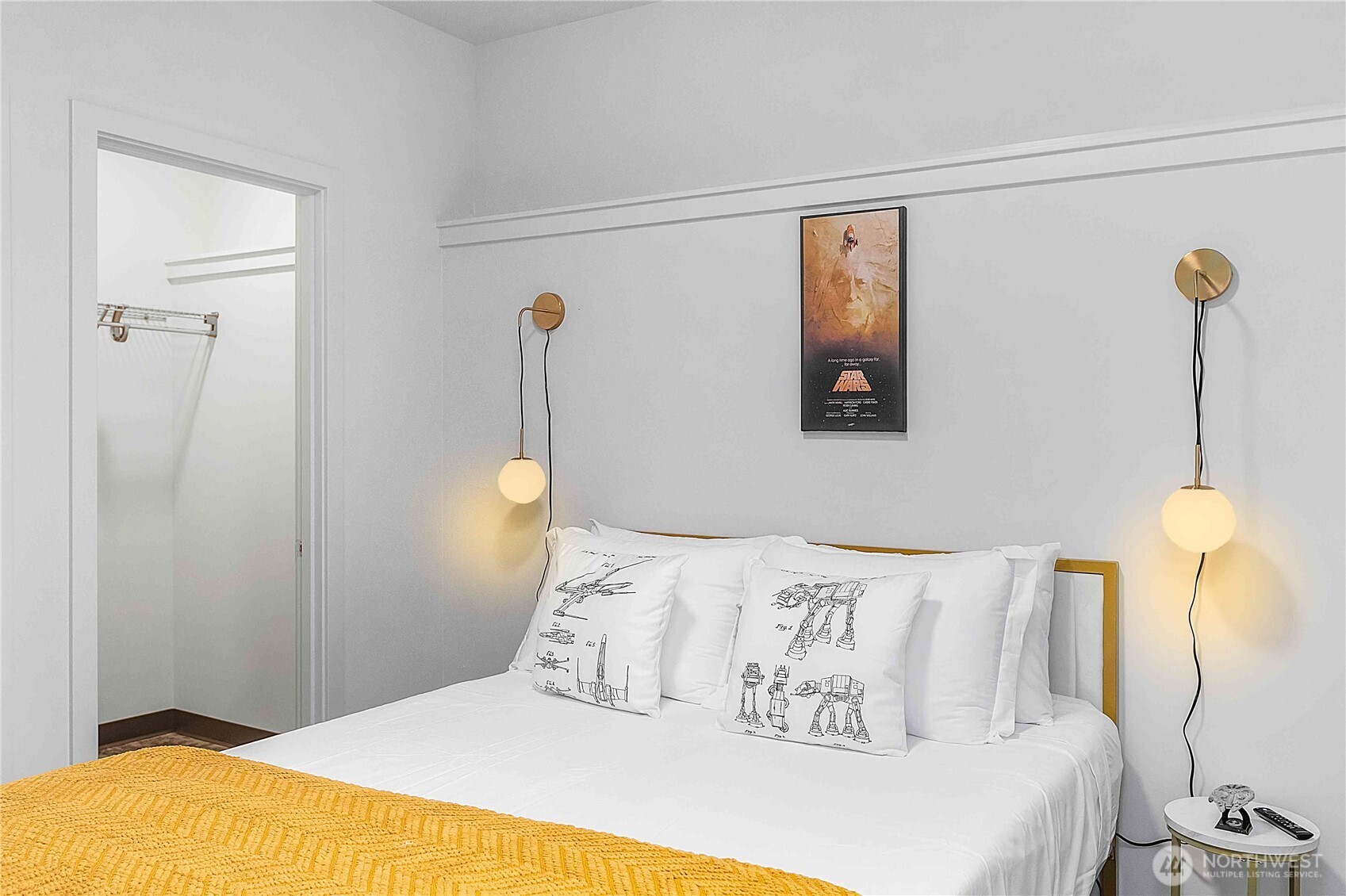 2613 3rd Avenue West Seattle, WA 98119 - Photo 18 of 26 a bedroom with a bed and a lamp with the view of a small room