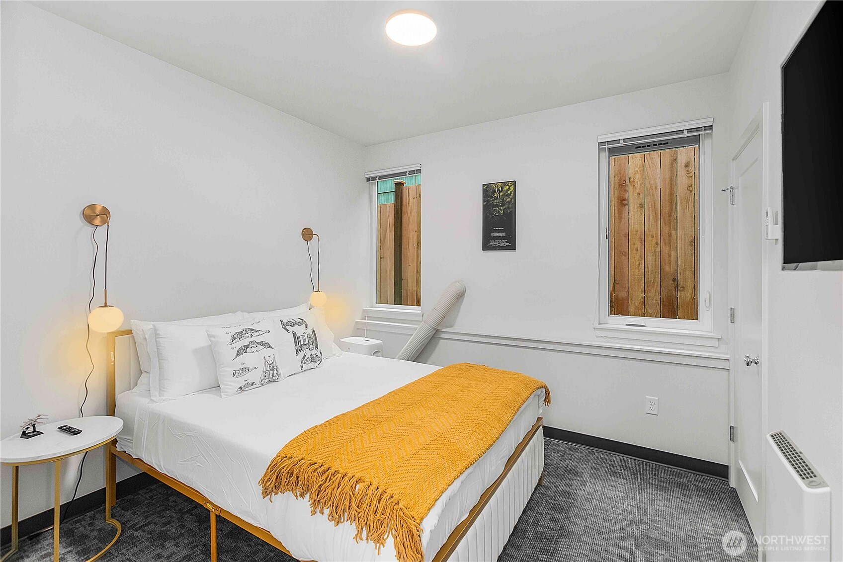 2613 3rd Avenue West Seattle, WA 98119 - Photo 21 of 26 a bedroom with a bed and a window