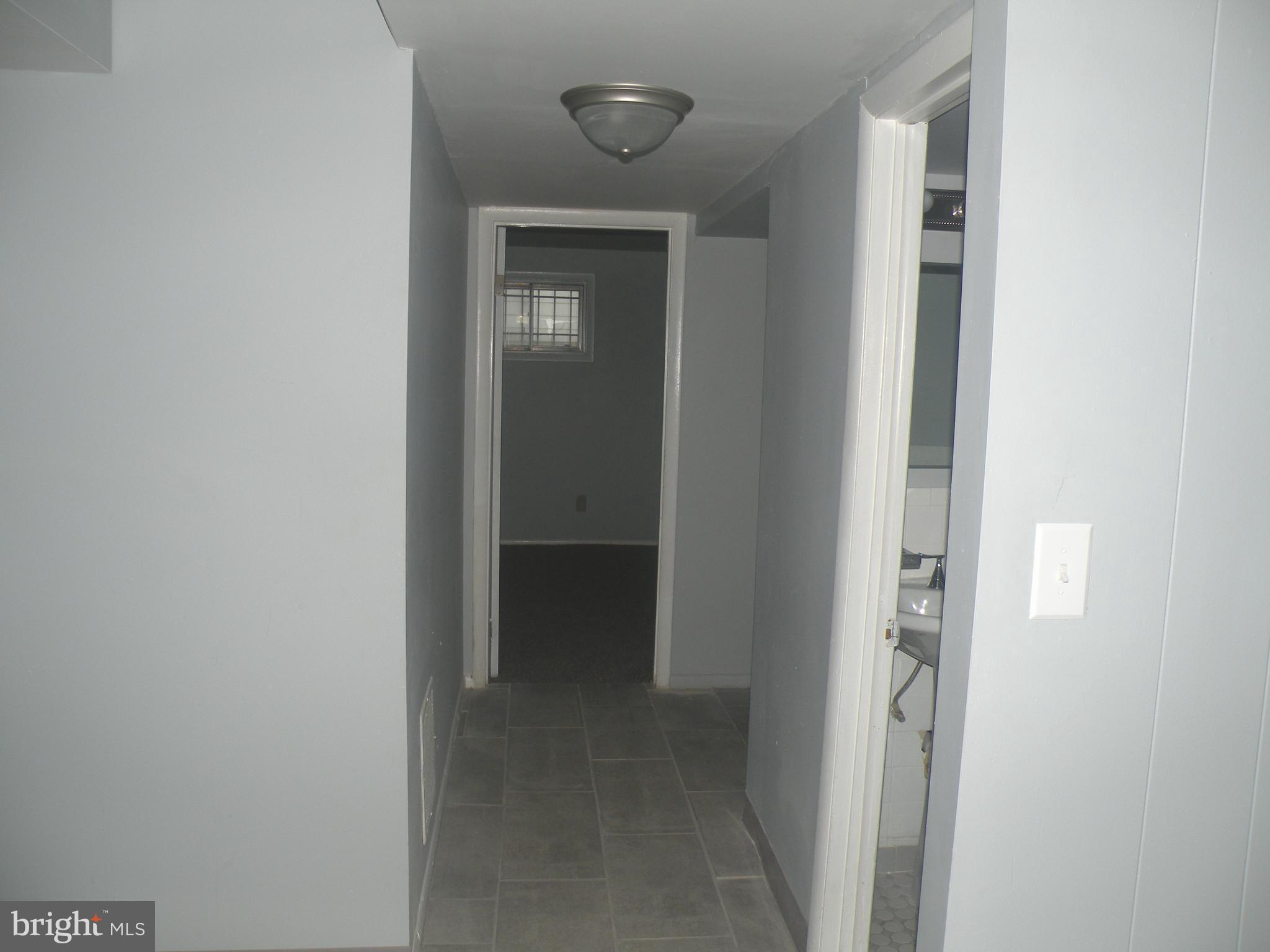 4518 Kinmount Road Lanham, MD 20706 - Photo 27 of 32 Basement Walkway