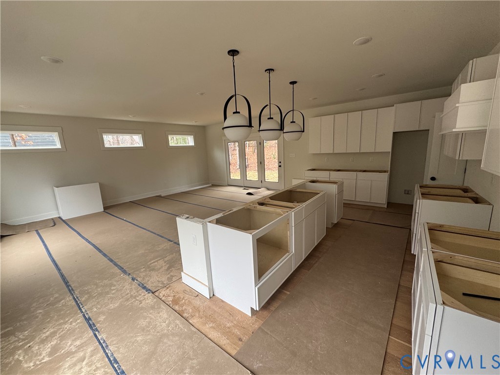 3020 Bradwill Road Richmond, VA 23225 - Photo 2 of 6 a kitchen with stainless steel appliances granite countertop a stove a sink and a refrigerator