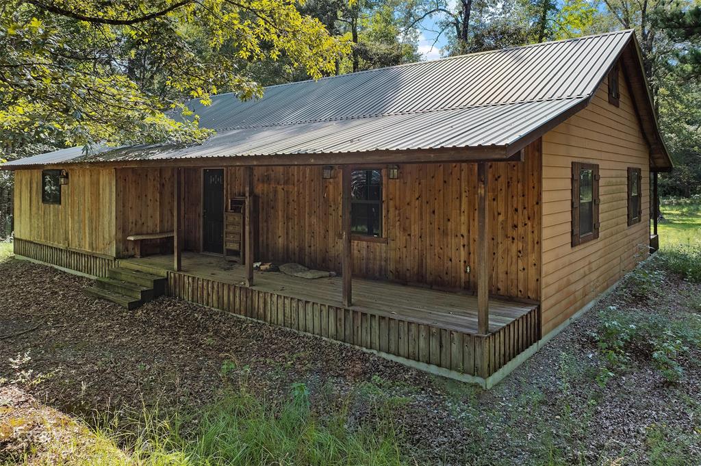 356 Cottage Grove Road Benton, LA 71006 - Photo 8 of 15 a view of a small house with wooden fence