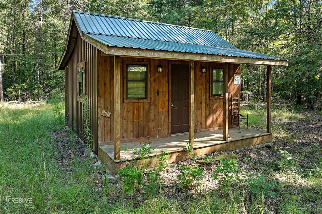 356 Cottage Grove Road Benton, LA 71006 - Photo 9 of 15 a view of a small house with garden