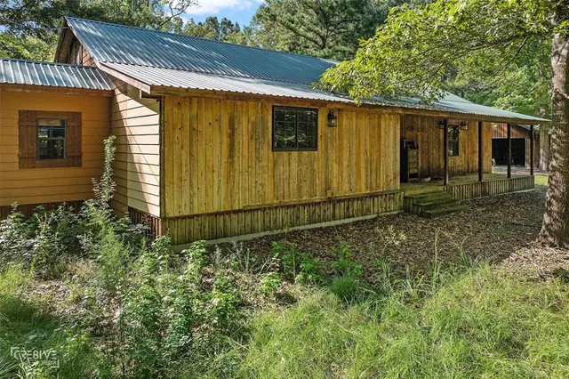 a backyard of a house with lots of green space