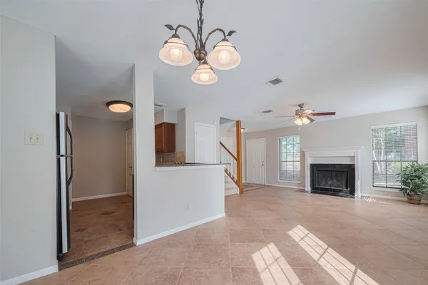 a view of a livingroom with an empty space and a fireplace