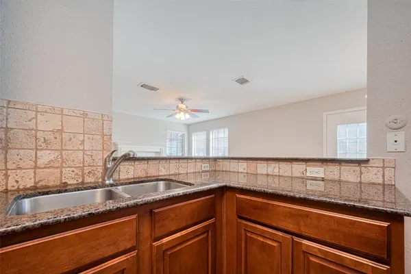 a kitchen with a sink and cabinets