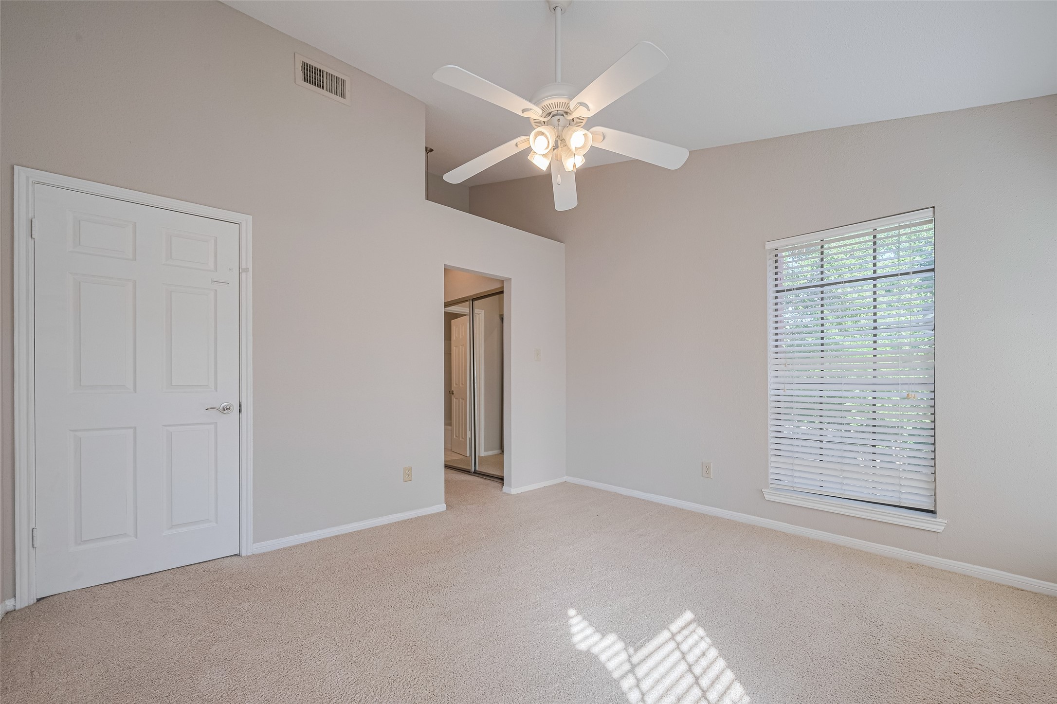 2211 South Kirkwood Road, Unit 19 Houston, TX 77077 - Photo 23 of 39 an empty room with windows and fan
