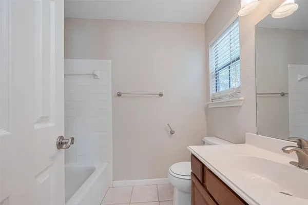 a bathroom with a sink toilet and vanity