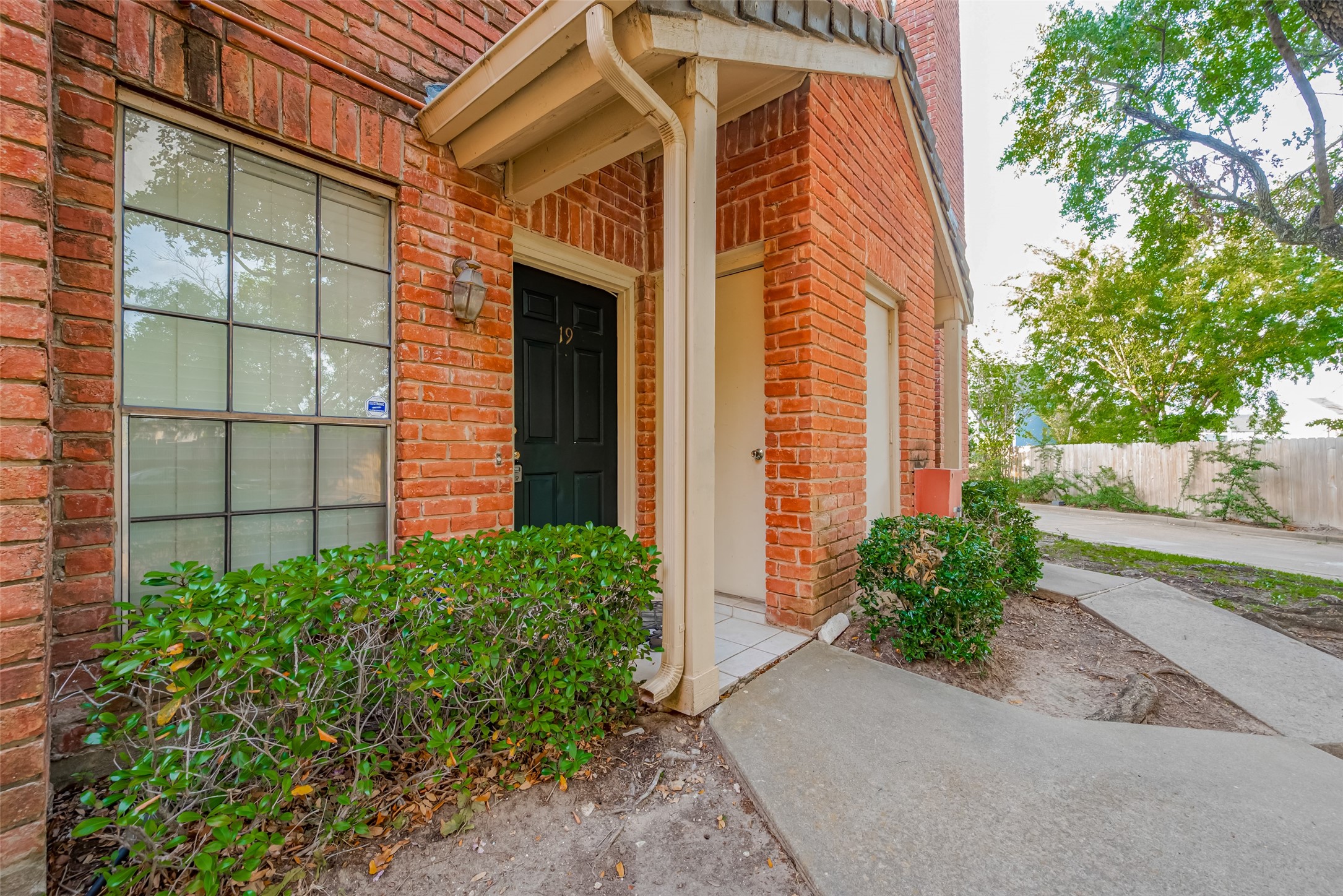 2211 South Kirkwood Road, Unit 19 Houston, TX 77077 - Photo 3 of 39 front view of a house